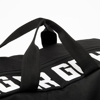 Black duffel bag with white text in black background